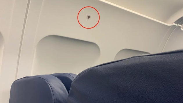 Black triangle above plane window