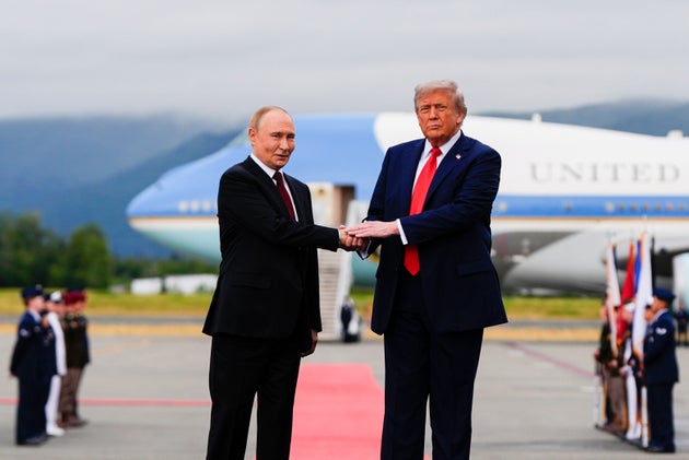 President Donald Trump greets Russia's President Vladimir Putin, Friday, Aug. 15, 2025, Alaska.