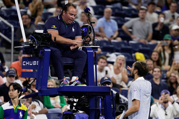 Daniil Medvedev berates chair umpire Greg Allensworth after a photographer ran onto the court during a match against Benjamin Bonzi.