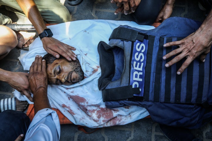 Loved ones mourn at funeral ceremony outside Nasser Hospital for Reuters photojournalist Hussam al-Masri, Al Jazeera cameraman Mohammed Salama, AP journalist Maryam Abu Daqqa, and NBC News journalist Moaz Abu Taha, all of whom were killed in an Israeli attack on the hospital in Khan Younis, Gaza on Aug. 25.