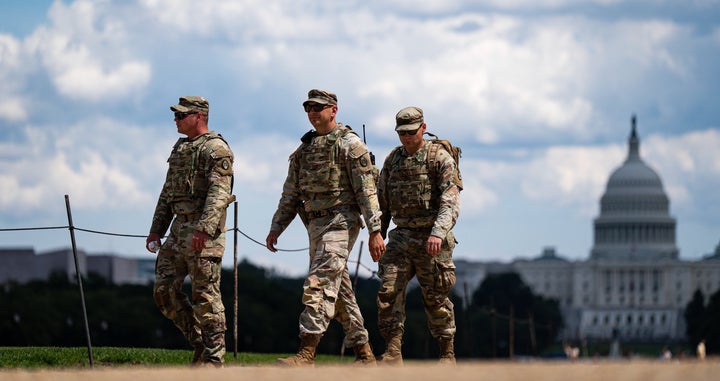 Members of the North Carolina Army National Guard's 30th Armored Brigade Combat Team patrol near the US Capitol on the National Mall in Washington, DC, US, on Thursday, Aug. 28, 2025. President Donald Trump threatened that prosecutors would seek the death penalty for anyone found guilty of murder in Washington, D.C., a move that would escalate his crime crackdown in the nation's capital.