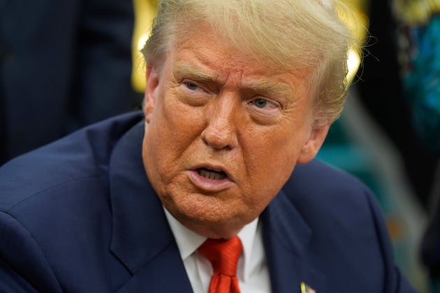 Donald Trump answers questions from reporters as he meets with Congo's Foreign Minister Therese Kayikwamba Wagner, and Rwanda's Foreign Minister Olivier Nduhungirehe, Friday, June 27, 2025.