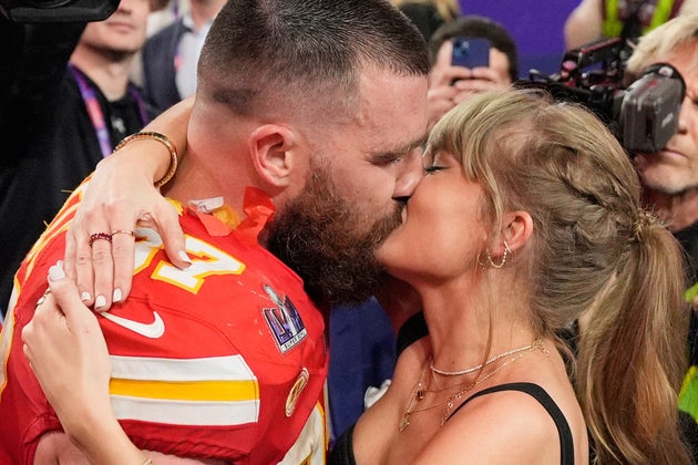 Travis Kelce and Taylor Swift share a kiss after the 2024 Super Bowl