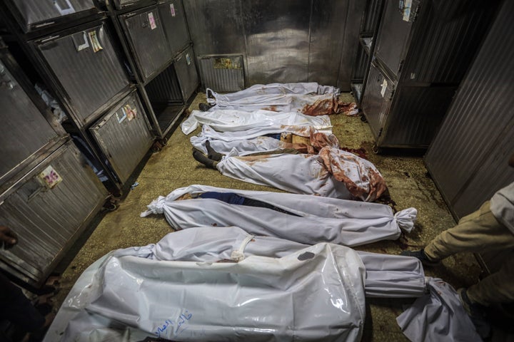 The bodies of 25 Palestinian civilians killed by Israeli forces in northern Gaza lie on the ground at Al-Shifa Hospital, including some who were seeking humanitarian aid in the Zikim area, on Aug. 31, 2025.