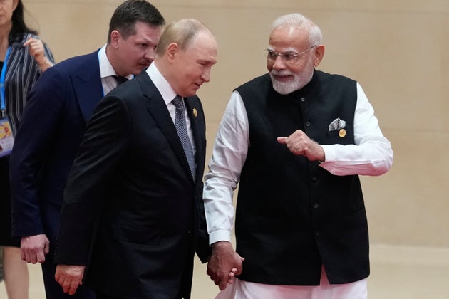 Indian Prime Minister Narendra Modi, right, walks with Russian President Vladimir Putin during the Shanghai Cooperation Organization (SCO) summit at the Meijiang Convention and Exhibition Center in Tianjin, China, Monday.