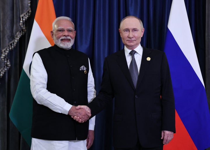 In this pool photograph distributed by the Russian state agency Sputnik, Russia's President Vladimir Putin and Indian Prime Minister Narendra Modi hold a meeting on the sidelines of the Shanghai Cooperation Organisation (SCO) Summit in Tianjin on September 1, 2025. (Photo by Alexander KAZAKOV / POOL / AFP via Getty Images)