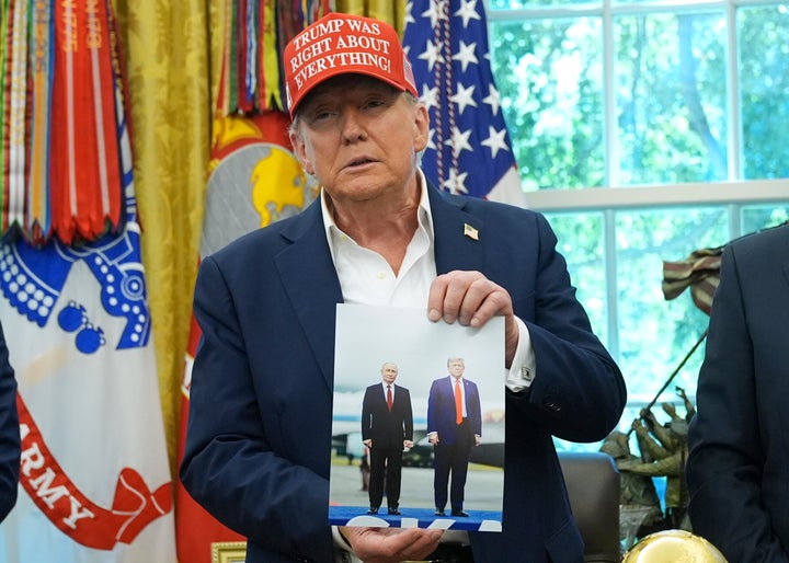 Indian Prime Minister Modi And Putin Affirm ‘Special’ Relationship At China Summit 2 President Donald Trump holds a photo of himself with Russian President Vladimir Putin during an announcement in the Oval Office of the White House, Friday, Aug. 22, 2025, in Washington. (AP Photo/Jacquelyn Martin)