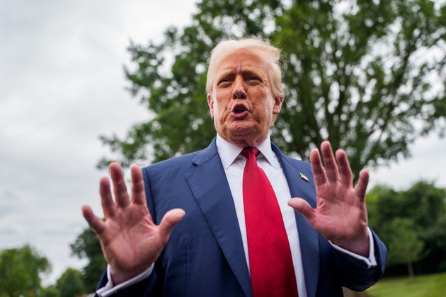 US President Donald Trump speaks to members of the media on the South Lawn of the White House before boarding Marine One in Washington, DC, US, on Friday, Aug. 1, 2025.