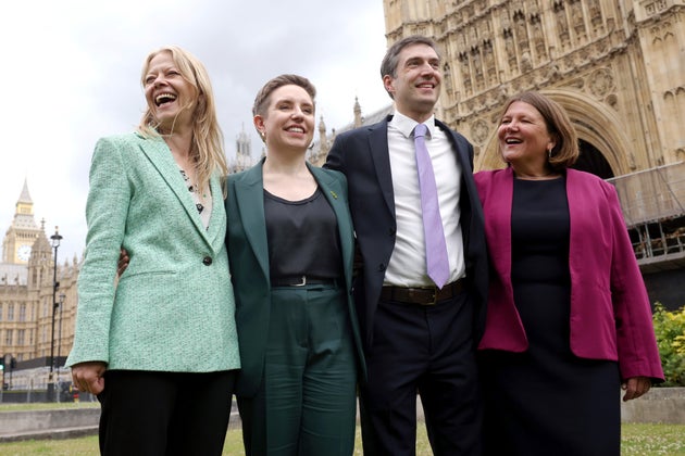 The four new Green MPs who won seats in the 2024 General Election, (L to R) Sian Berry (MP for Brighton Pavilion), former party co-leader Carla Denyer (MP for Bristol Central), former party co-leader Adrian Ramsay (MP for Waveney Valley) and Ellie Chowns (MP for North Herefordshire) pose for photos on Abingdon Green, opposite the Palace of Westminster on July 08, 2024 in London, England.