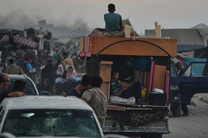 Displaced Palestinians fleeing northern Gaza Strip move with their belongings along the Sea Road, in Gaza City, on Sept. 1, 2025.