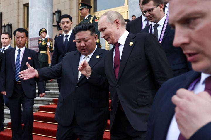Russian President Vladimir Putin, second right, and North Korean leader Kim Jong Un gesture as they leave a reception following a military parade to commemorate the 80th anniversary of the end of World War II in Beijing, China, Wednesday, Sept. 3, 2025.