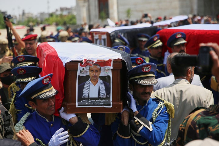 Honor guards carry the coffin of Houthi Minister of Culture and Tourism Ali al-Yafei, as well as the coffins of other officials killed in Israeli airstrikes days earlier, during a funeral ceremony at the Shaab Mosque in Sanaa, Yemen, on Sept. 1, 2025.
