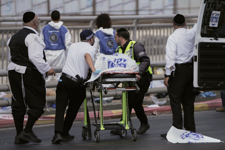 At Least 6 Killed In Jerusalem Capturing Assault, Israeli Authorities Say 1 Israeli Zaka rescue and recovery team carry the body of a victim at the scene of shooting attack carried out by two Palestinian shooters, in which several people were killed and others injured at a bus stop in Jerusalem, on Sept. 8, 2025.