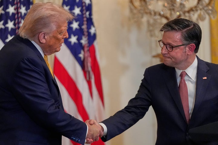 President Donald Trump shakes hands with House Speaker Mike Johnson of La., during a reception for Republican members of Congress in the East Room of the White House, on July 22, 2025, in Washington.