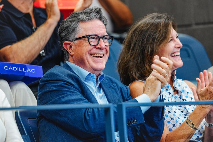 Stephen Colbert and Evelyn McGee Colbert happily applauding at the Open of US 2025.
