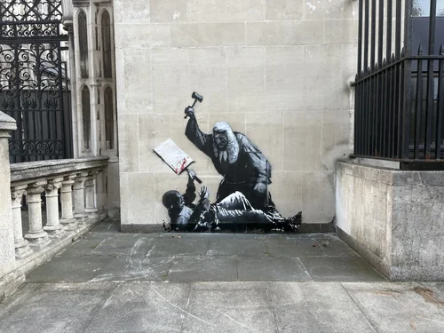 Banksy's Provocative New Mural Outside London Court Prompts Swift