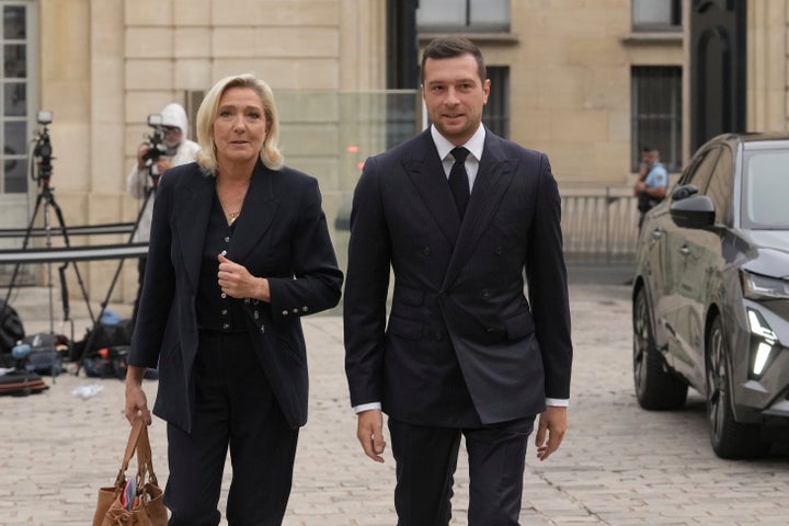 Far-right National Rally politician Marine Le Pen and National Rally party president Jordan Bardella arrive to meet French Prime Minister Francois Bayrou before a confidence vote at the Hotel Matignon in Paris on Sept. 2, 2025.