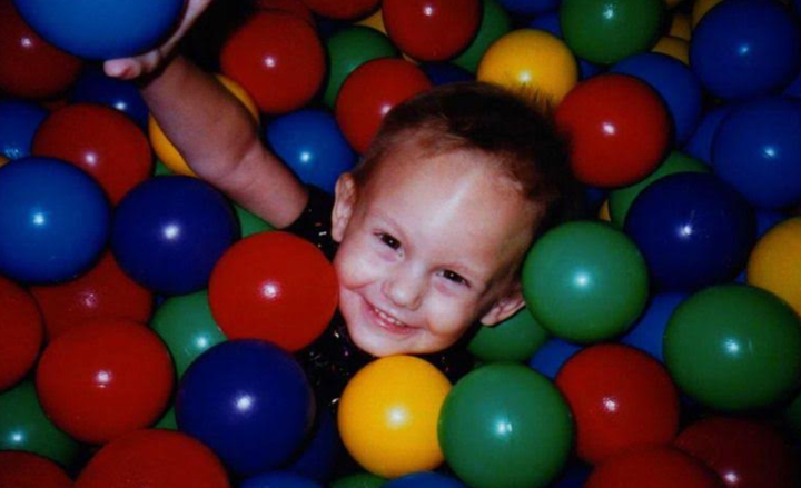Jillian in a ball pit at her 3rd birthday party.
