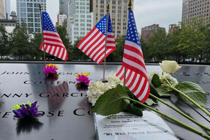 Flags and flowers are placed in the inscribed names at the National September 11 Memorial in New York on Sept. 10, 2025. 