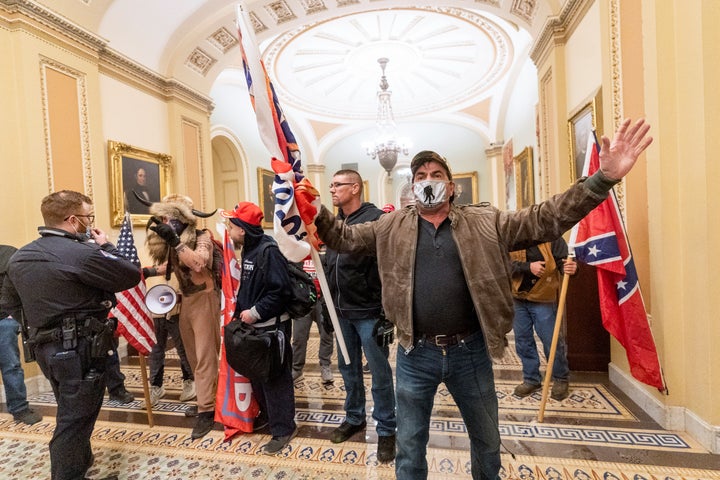 A Jan. 6 Rioter Is Getting Navy Funeral Honors — And A Democrat Is Attempting To Cease It 1 In this Jan. 6, 2021, file photo, supporters of President Donald Trump are confronted by U.S. Capitol Police officers outside the Senate Chamber inside the Capitol in Washington. Both within and outside the walls of the Capitol, banners and symbols of white supremacy and anti-government extremism were displayed as an insurrectionist mob swarmed the U.S. Capitol.