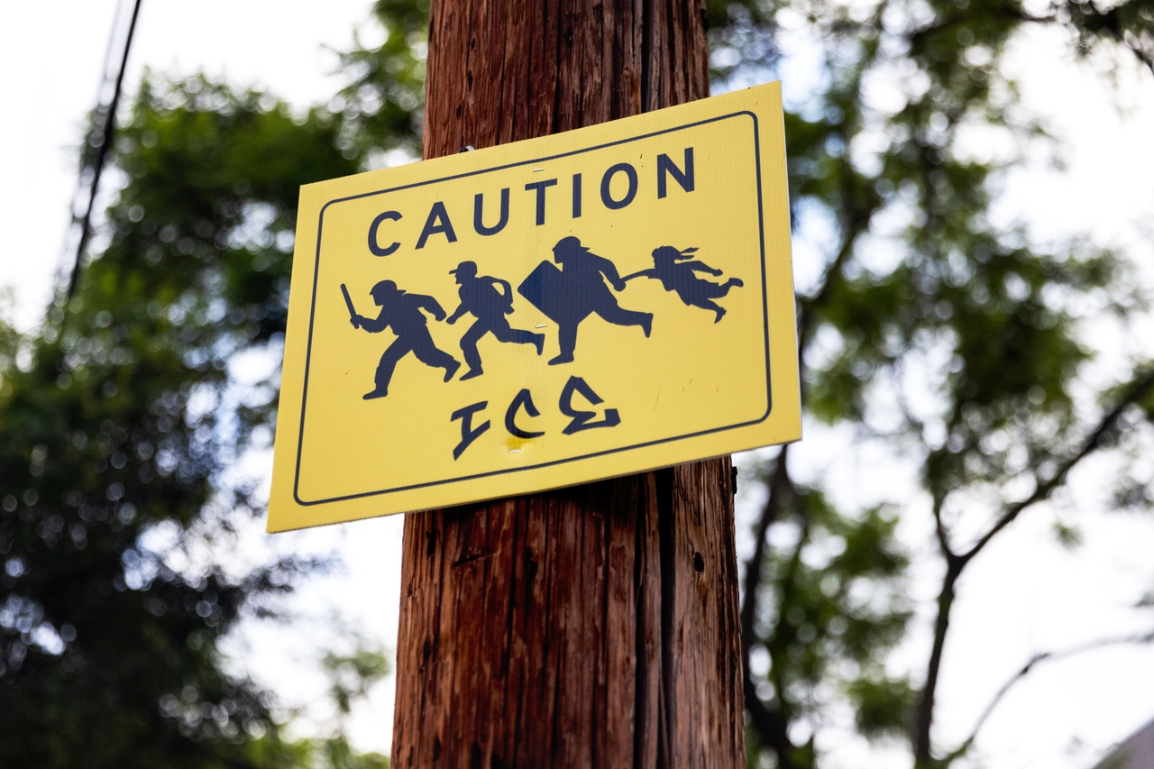 A sign warning of ICE activity is posted outside an elementary school in Los Angeles on Sept. 11, 2025.