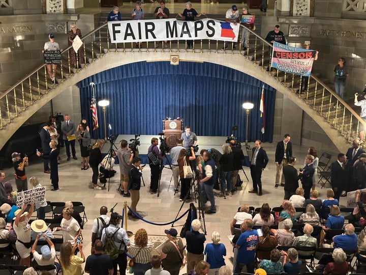 People opposed to a plan to redraw Missouri's U.S. House districts gather at the state Capitol in Jefferson City, Mo. on Wednesday, Sept. 10, 2025. (AP Photo/David A. Lieb)