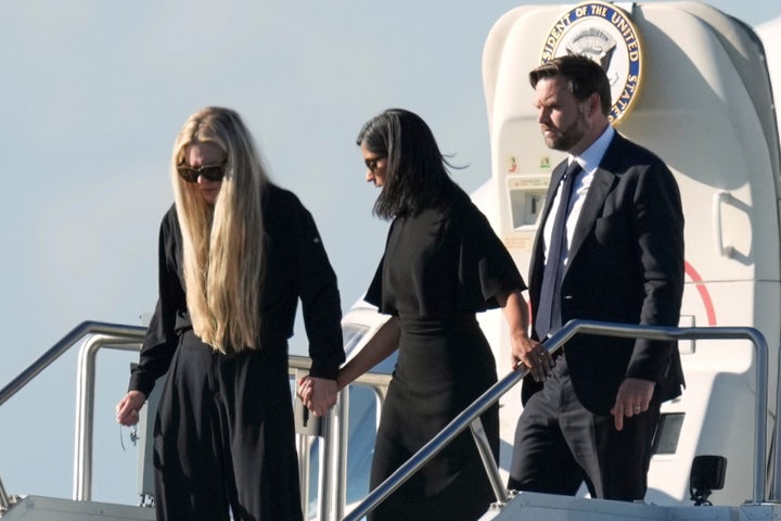 Erika Kirk, left, with second lady Usha Vance and Vice President JD Vance, deplanes Air Force Two in Phoenix on Thursday. The plane was carrying the body of Charlie Kirk, the CEO and co-founder of Turning Point USA.