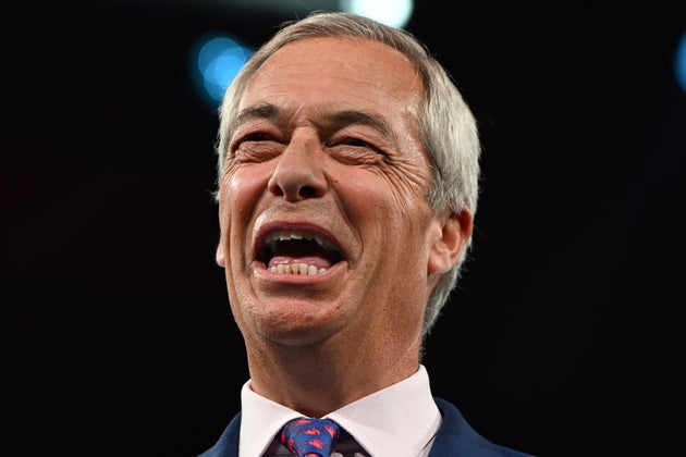 Britain's Reform UK party leader Nigel Farage reacts during the Reform party's annual conference at the National Exhibition Centre in Birmingham, England, Saturday, Sept. 6, 2025.(AP Photo/Thomas Krych)