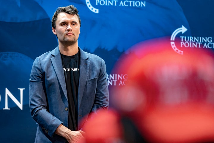 Kari Lake floated an easy-to-debunk conspiracy about Charlie Kirk's alleged killer during a prayer vigil for the late political activist on Sunday. Kirk is pictured here at University of Arizona on Oct. 17.