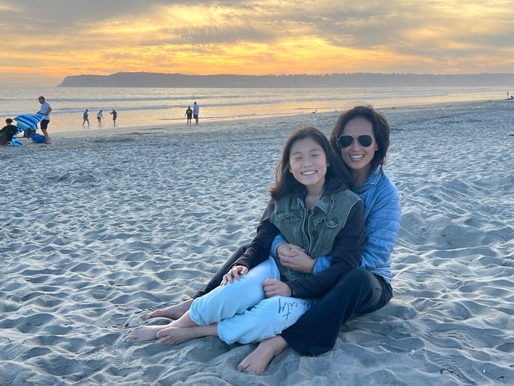 The author with her daughter Nell on the beach 2.5 years after her diagnosis.