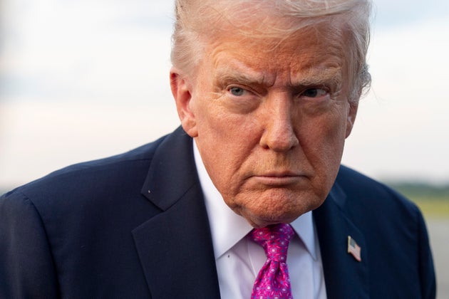 President Donald Trump speaks with reporters before he departs on Air Force One at Morristown Airport on Sept. 14 in Morristown, New Jersey.