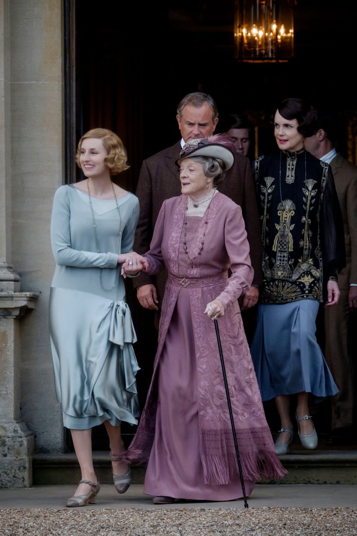 Hugh and Dame Maggie on the set of Downton Abbey with co-stars Elizabeth McGovern and Laura Carmichael