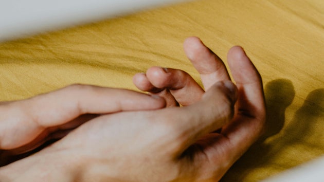 Hand in bed