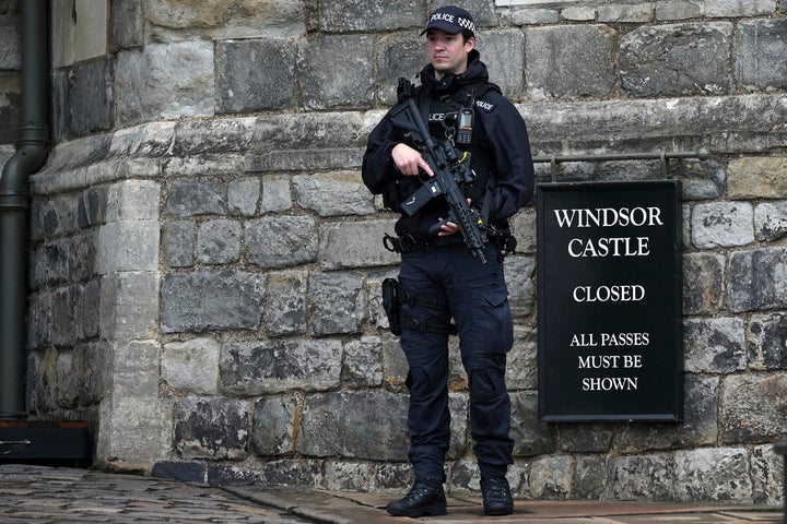 An armed police officer stands guard at the entrance to Windsor Castle ahead of the arrival of President Donald Trump in Windsor, England, on Sept. 17, 2025.