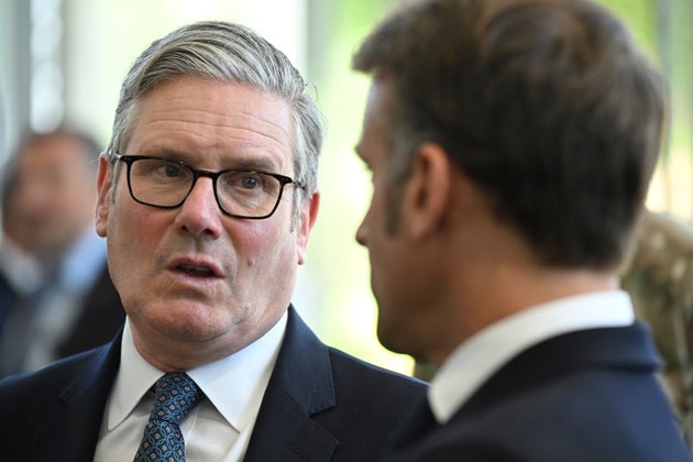 Prime Minister Keir Starmer and French President Emmanuel Macron, right, talk during a joint military visit to the MARCOM centre, maritime command centre in Northwood, London, Thursday July 10, 2025.