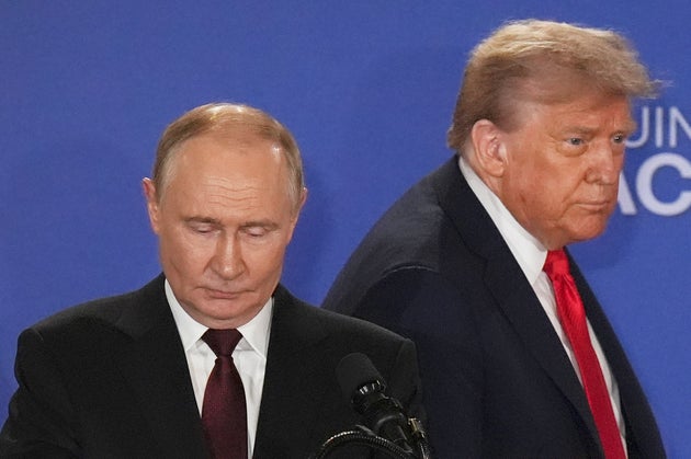 President Donald Trump, right, Russia's President Vladimir Putin arrive for a joint press conference at Joint Base Elmendorf-Richardson, Alaska, Friday, Aug. 15, 2025.