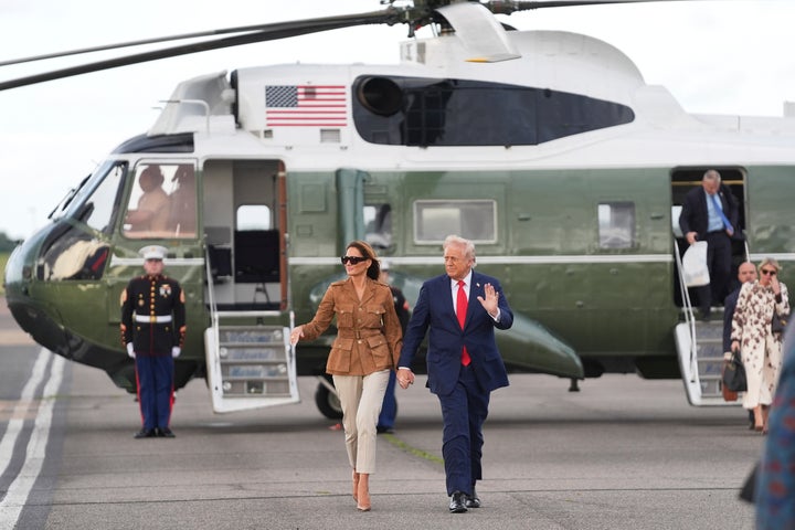 President Donald Trump and first lady Melania Trump wave after arriving on Marine One at Stansted Airport, on Sept. 18, 2025, in Stansted, England. 
