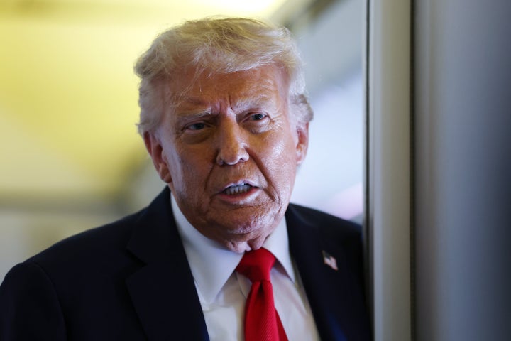 U.S. President Donald Trump speaks to reporters on Air Force One on September 18, 2025 during a flight to Joint Base Andrews, Maryland. (Photo by Anna Moneymaker/Getty Images)