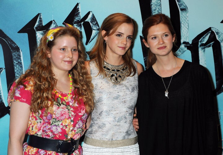 ' 1 Jessie Cave, from the left, Emma Watson and Bonnie Wright perch during the photocall of