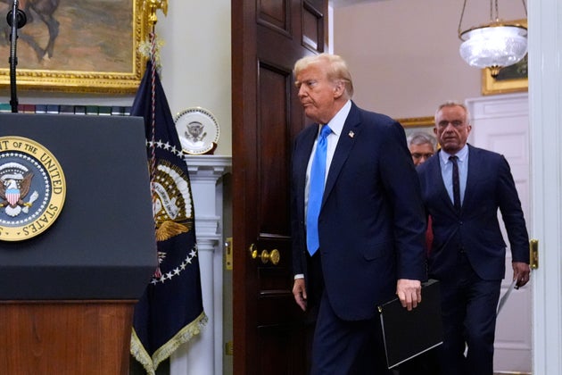 President Donald Trump arrives with Health and Human Services Secretary Robert F. Kennedy Jr., to speak in the Roosevelt Room of the White House, Monday, Sept. 22, 2025, in Washington.
