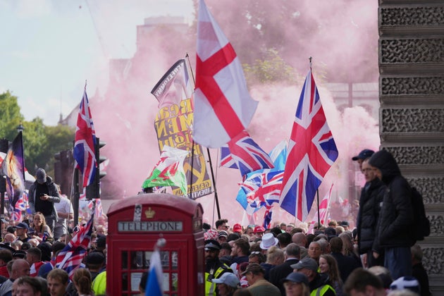 People demonstrate during the Tommy Robinson-led Unite the Kingdom march and rally, in London, Saturday Sept. 13, 2025. 