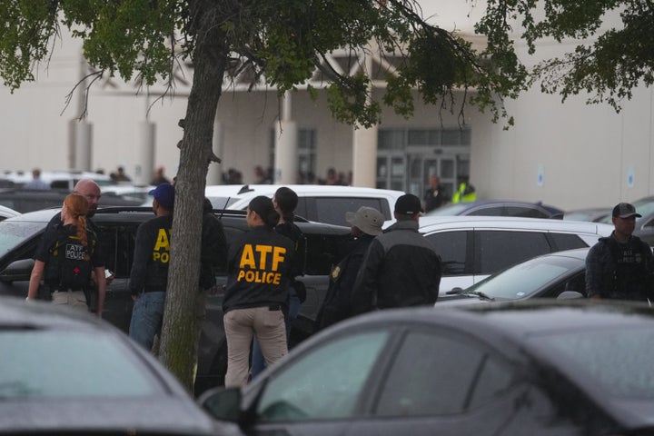 Law enforcement gather at a stating area close to a U.S. Immigration and Customs Enforcement office after a reported shooting, in Dallas on Wednesday, Sept. 24, 2025. (AP Photo/Julio Cortez)