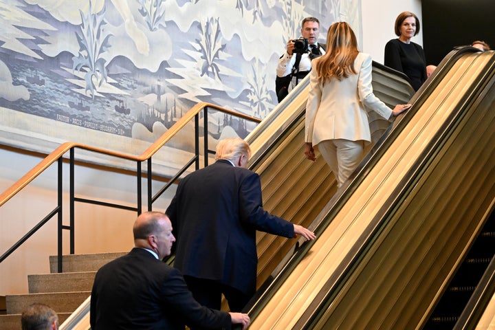 Trump and first lady Melania Trump were forced to walk up an escalator after their videographer inadvertently triggered an emergency stop mechanism.