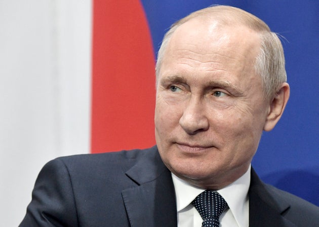 Russian President Vladimir Putin listens to Moldovan President Igor Dodon during their meeting at the Supreme Eurasian Economic Council meeting in Nur-Sultan, the capital city of Kazakhstan, Wednesday, May 29, 2019.