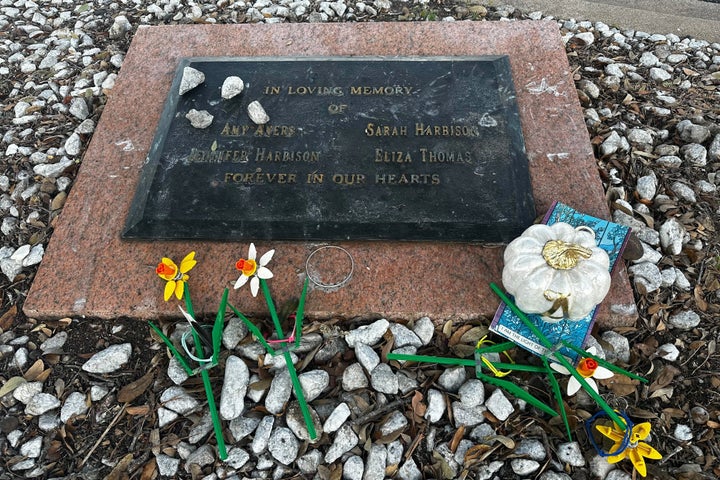 Tributes lay on a memorial Friday, Sept. 26, 2025, for four teenage girls who were killed in a yogurt shop in 1991 in Austin, Texas. (AP Photo/Paul J. Weber)