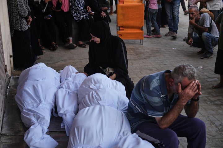 Palestinians mourn during the funeral of people killed in an Israeli military strike, outside Al-Aqsa Hospital in Deir al-Balah, central Gaza Strip, Wednesday, Sept. 24, 2025. (AP Photo/Abdel Kareem Hana)