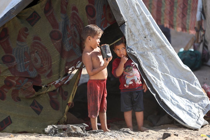 Displaced children stand in a tent at a camp in southern Gaza's Khan Younis, on Sept. 29, 2025. On the same day, President Donald Trump said he was "very confident" of a ceasefire deal ahead of Israeli Prime Minister Benjamin Netanyahu's visit to the White House.