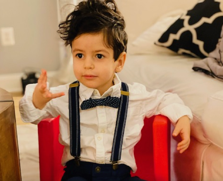 The author's son Max in December 2021 sitting in his red chair, which he loved and which was mentioned by the medium.