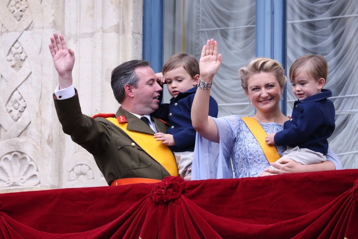 Luxembourg's Grand Duke Guillaume and Grand Duchess Stephanie hold their children, Prince Charles and Prince Francois, as they wave from the balcony of the Grand Ducal Palace in Luxembourg on Friday.