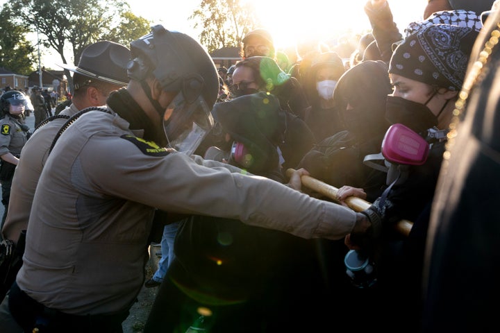 BROADVIEW, ILLINOIS - OCTOBER 03: Police clash with demonstrators during a protest outside an immigrant processing and detention center on October 03, 2025 in Broadview, Illinois. The site has been the target of frequent protests as federal law enforcement agents continue Operation Midway Blitz in the Chicago area, an operation designed to apprehend and deport undocumented immigrants living in the area. (Photo by Scott Olson/Getty Images)